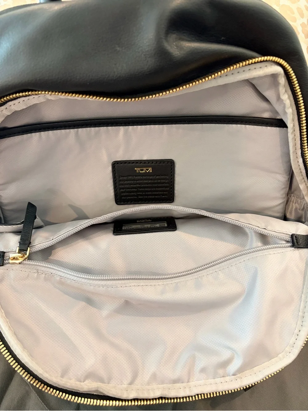 Tumi Black Leather Backpack with Gold Hardware